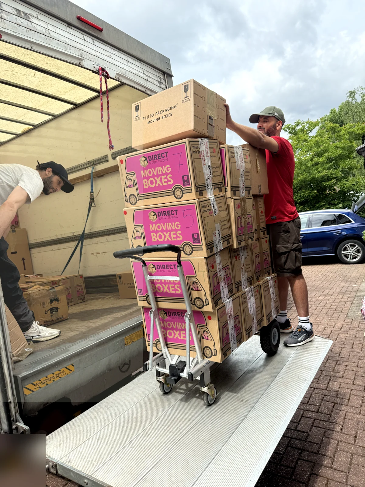 ZippyVan team loading packed moving boxes into a van