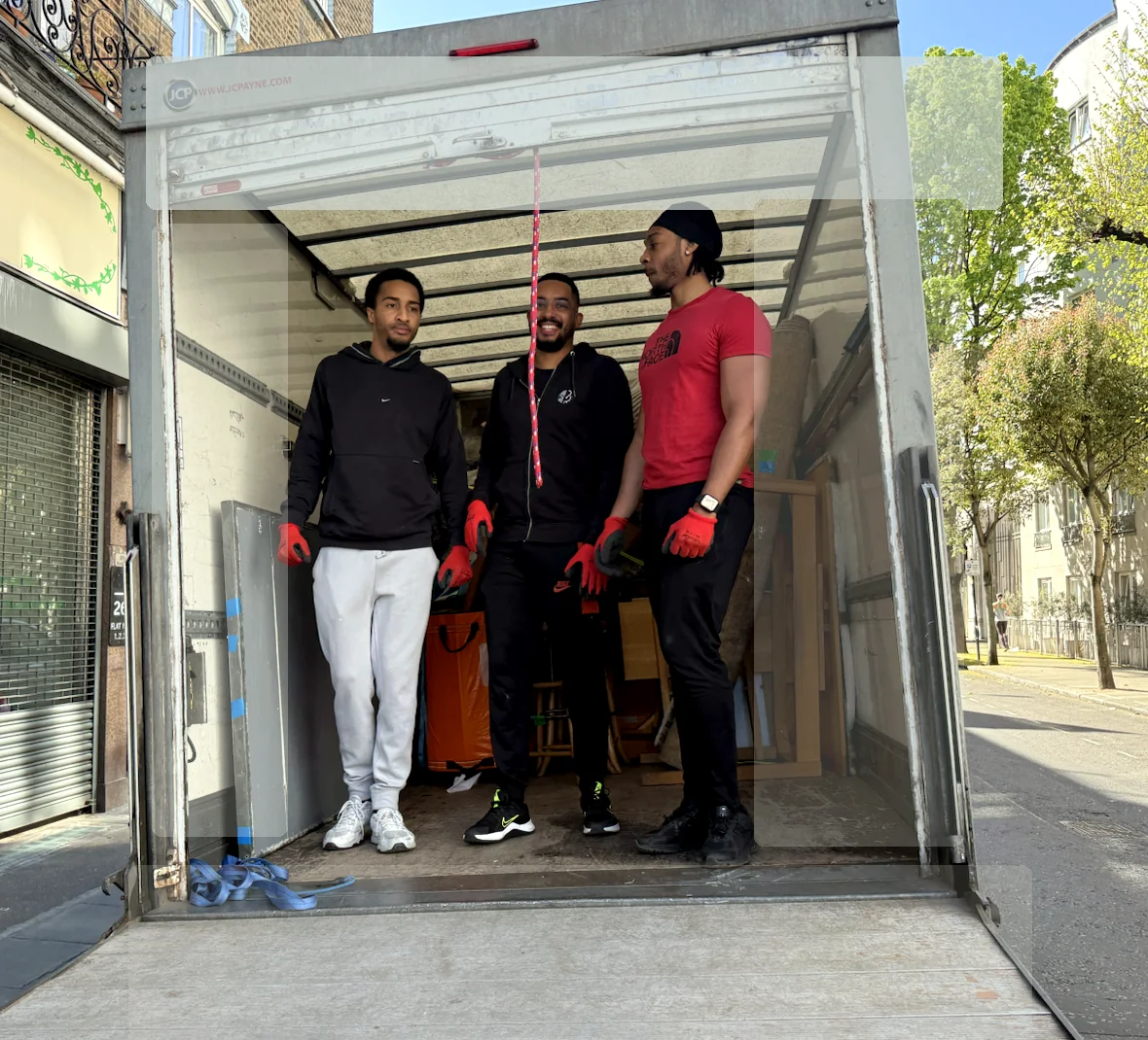 ZippyVan moving team standing inside a clean Luton van after loading